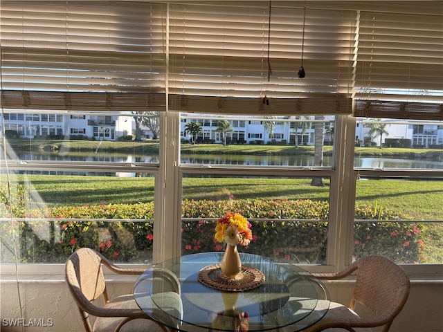 sunroom with a water view