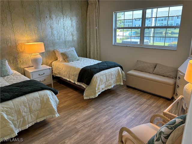 bedroom with hardwood / wood-style floors