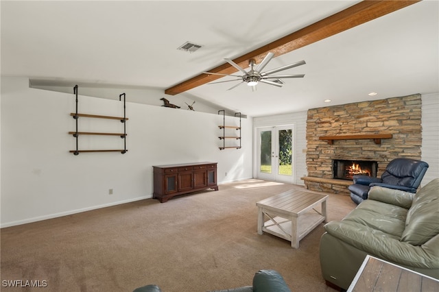 carpeted living room with vaulted ceiling with beams, ceiling fan, a fireplace, and french doors