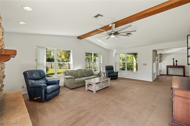 carpeted living room with vaulted ceiling with beams, a wealth of natural light, and ceiling fan