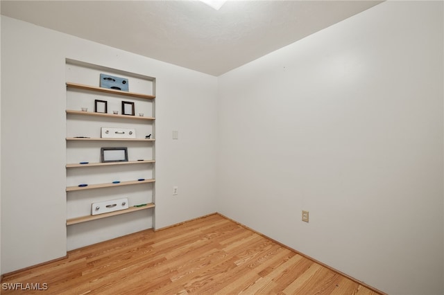 unfurnished room with light hardwood / wood-style floors