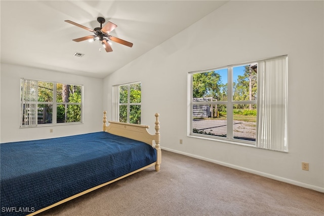 unfurnished bedroom with ceiling fan, carpet floors, and high vaulted ceiling