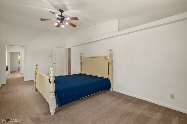 unfurnished bedroom featuring ceiling fan, high vaulted ceiling, and light carpet