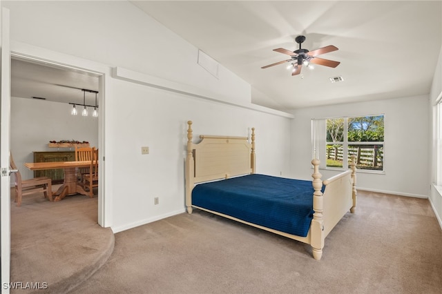 carpeted bedroom featuring ceiling fan and lofted ceiling