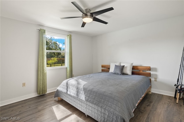 bedroom featuring dark hardwood / wood-style floors and ceiling fan