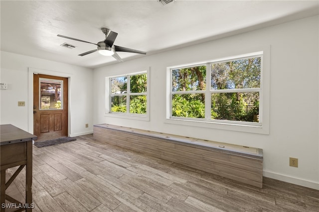 interior space featuring ceiling fan and wood-type flooring