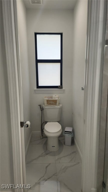 bathroom featuring toilet