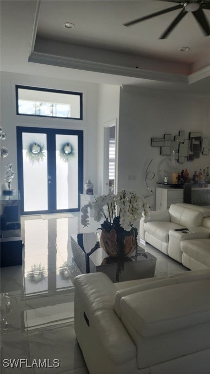 living room featuring a raised ceiling