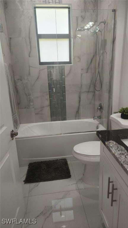 full bathroom with tiled shower / bath combo, toilet, and vanity