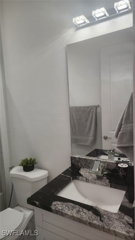 bathroom with vanity and toilet