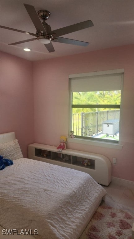 bedroom featuring tile patterned flooring and ceiling fan