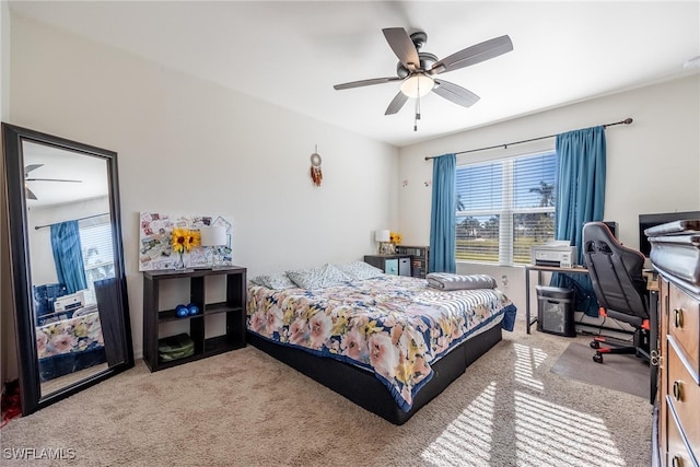 carpeted bedroom featuring ceiling fan