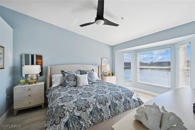 bedroom featuring ceiling fan and light hardwood / wood-style flooring