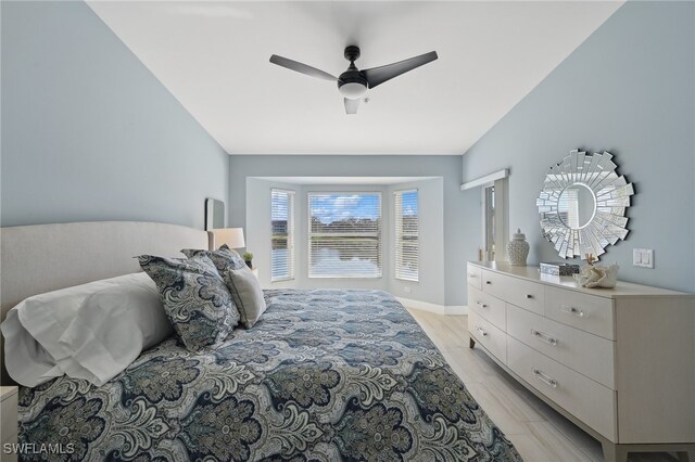 bedroom with ceiling fan and light hardwood / wood-style floors