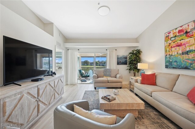 living room with light hardwood / wood-style flooring