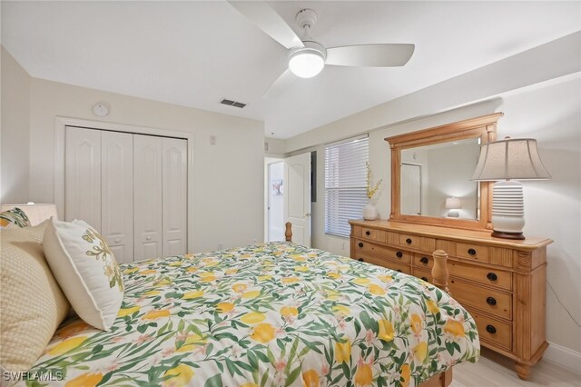 bedroom with ceiling fan, a closet, and light wood-type flooring