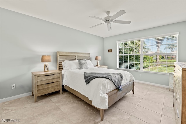 bedroom featuring ceiling fan and light tile patterned floors