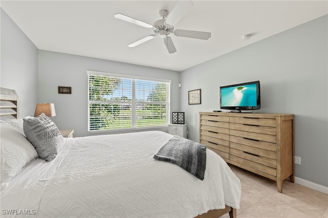 tiled bedroom with ceiling fan