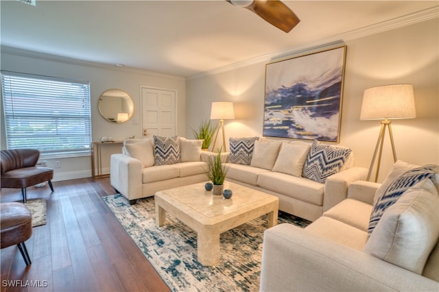 living room with hardwood / wood-style flooring and crown molding