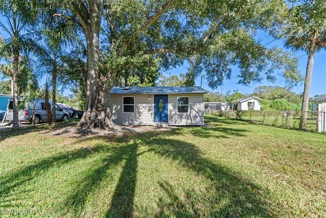 exterior space with an outbuilding and a front yard