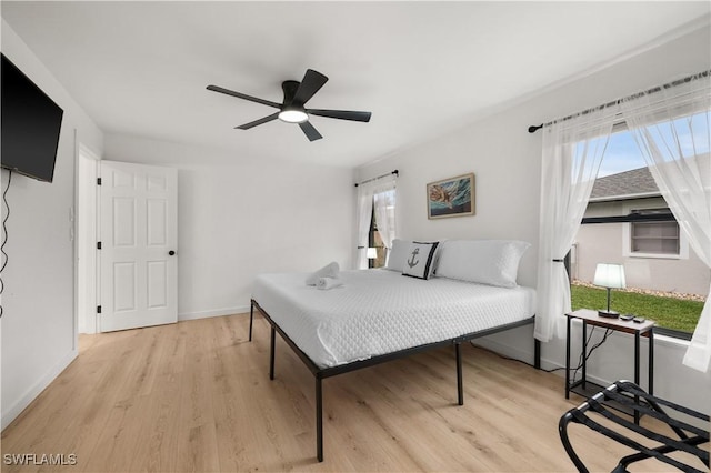 bedroom featuring light hardwood / wood-style floors and ceiling fan