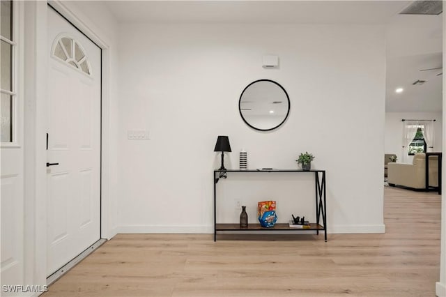 corridor with light wood-type flooring