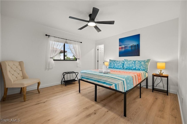 bedroom with light wood-type flooring and ceiling fan