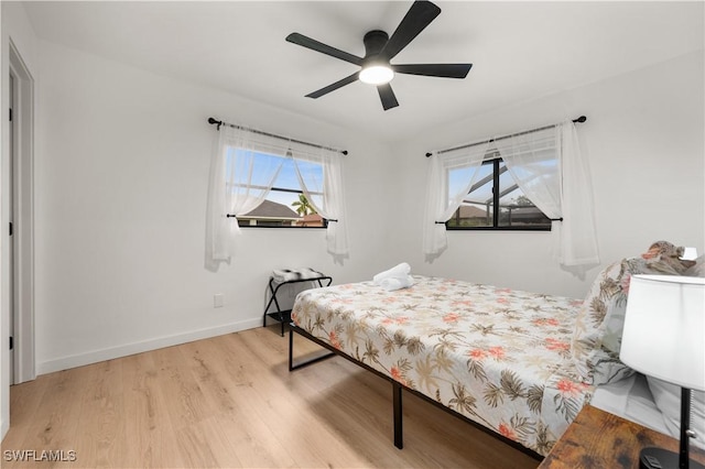 bedroom featuring light wood-type flooring and ceiling fan