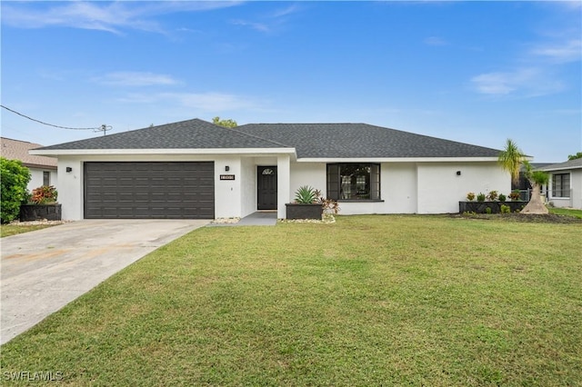 single story home with a front yard and a garage