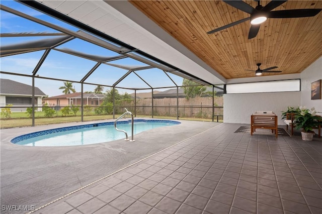 view of pool featuring ceiling fan, a lanai, and a patio