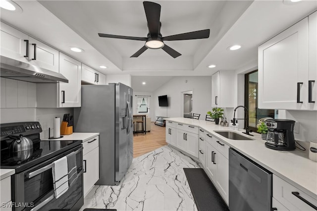 kitchen featuring stainless steel fridge, dishwasher, sink, black / electric stove, and white cabinets