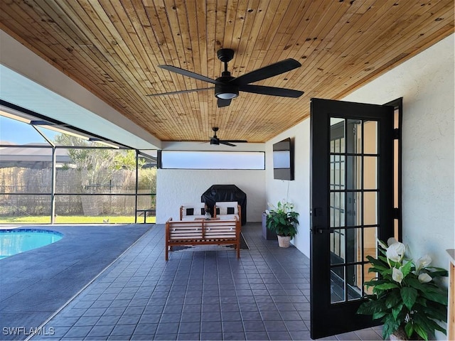 sunroom / solarium featuring wood ceiling