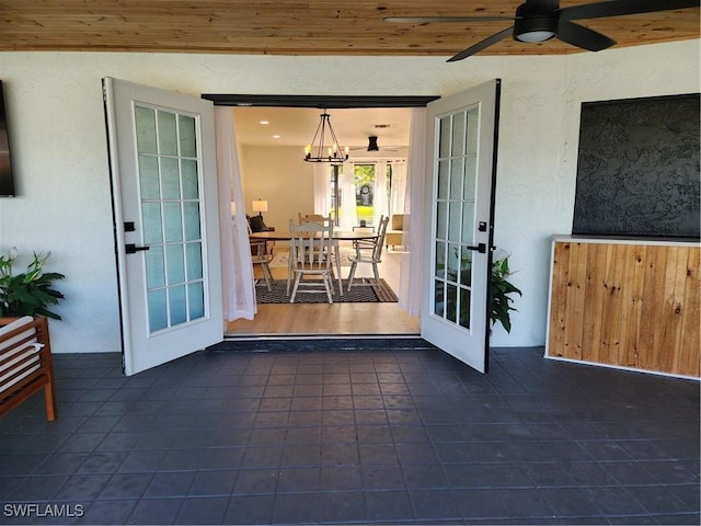 exterior space with ceiling fan and a patio area