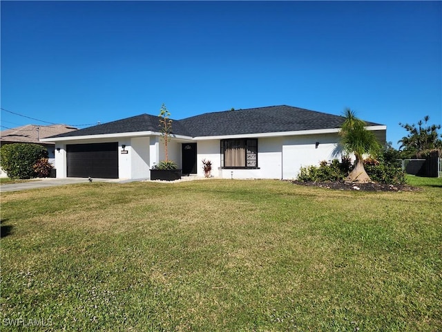 single story home with a front yard and a garage