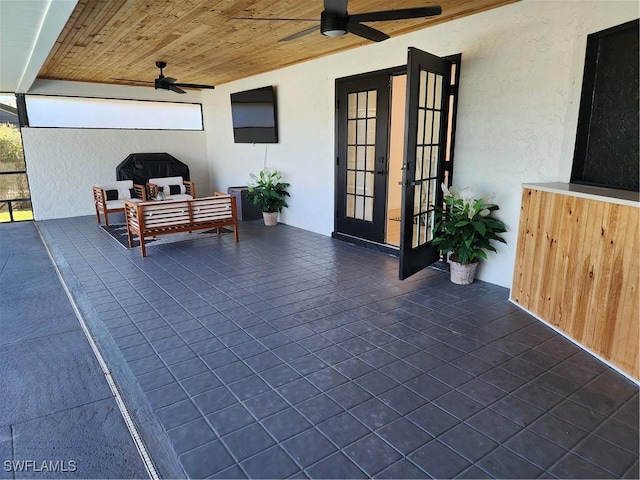 view of patio featuring ceiling fan