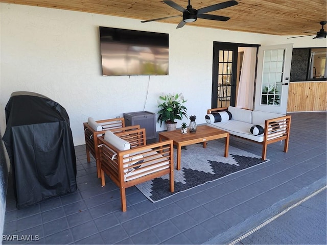 view of patio / terrace with an outdoor living space and ceiling fan