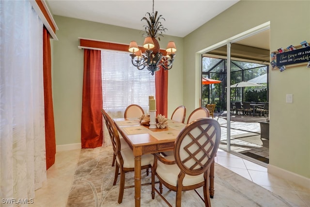 tiled dining area with a chandelier