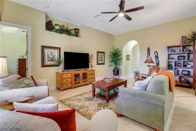 living room featuring ceiling fan and light tile patterned floors