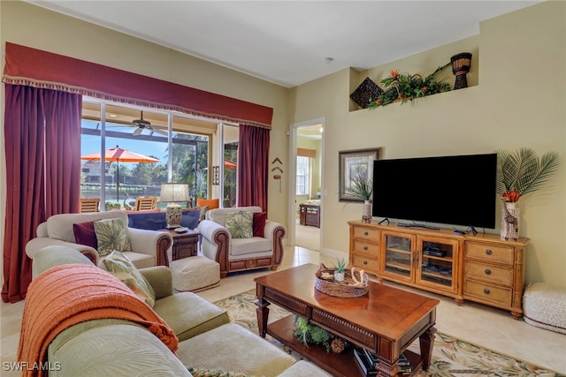 tiled living room with ceiling fan