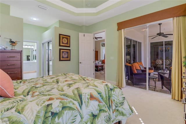 carpeted bedroom featuring ensuite bath and ornamental molding