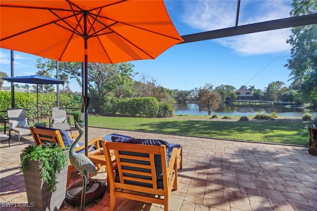 view of patio with a water view