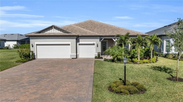 ranch-style home with a front lawn and a garage