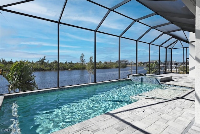 view of swimming pool with glass enclosure, a water view, and an in ground hot tub