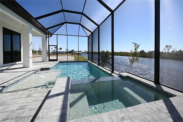 view of swimming pool featuring glass enclosure, a water view, an in ground hot tub, and a patio