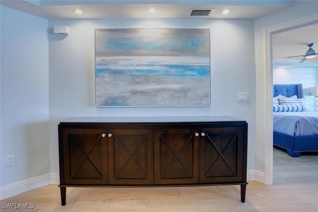 interior details featuring ceiling fan and hardwood / wood-style flooring