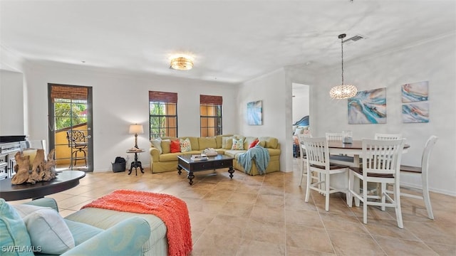 tiled living room featuring a chandelier and ornamental molding