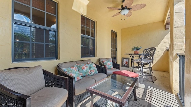 balcony with ceiling fan and an outdoor hangout area