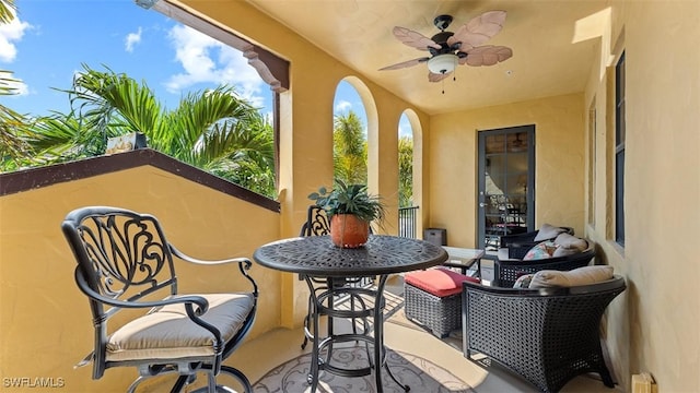 exterior space featuring outdoor lounge area and ceiling fan