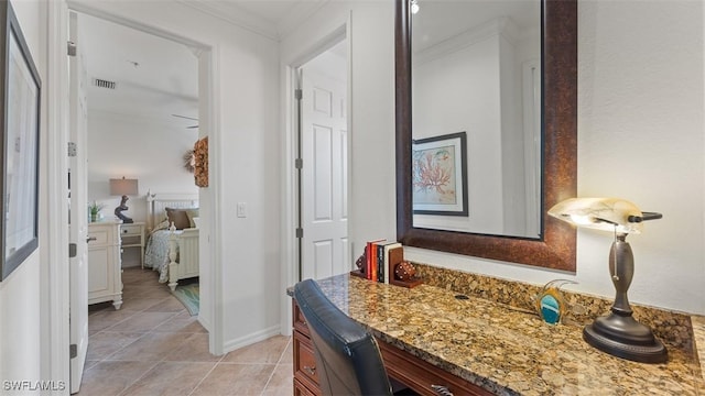 bathroom featuring crown molding, tile patterned flooring, and vanity