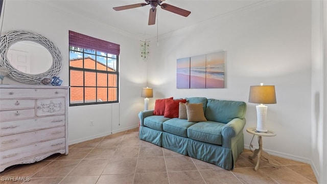 sitting room featuring ceiling fan, ornamental molding, and light tile patterned floors